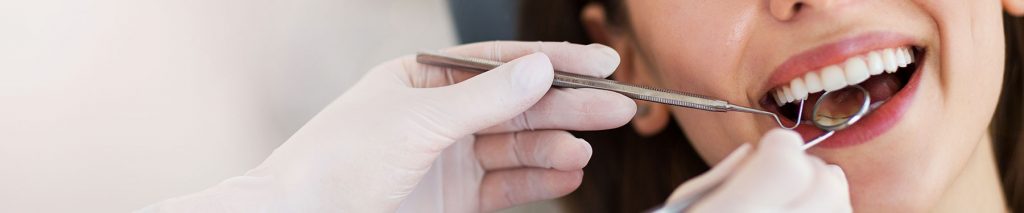 Young woman smiling during a dental checkup