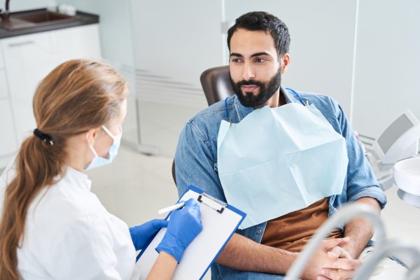 dentist speaking to patient